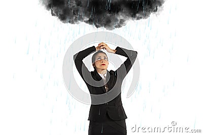 Unlucky businesswoman with a black cloud full of rain over her head Stock Photo