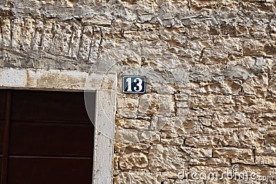 Unlucky thirteen house number sign Stock Photo