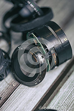Unmade pieces of a photography camera lens with convex glasses lens and electronic devices Stock Photo