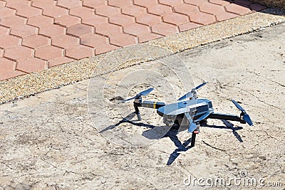 Unmanned aerial vehical with video camera hovers in the air. This is DJI Mavic Pro model. Editorial Stock Photo