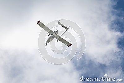 Unmanned aerial vehicle UAV in blue sky. Stock Photo