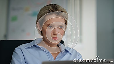 Unmotivated office worker looking laptop sitting workplace closeup. Lady reading Stock Photo