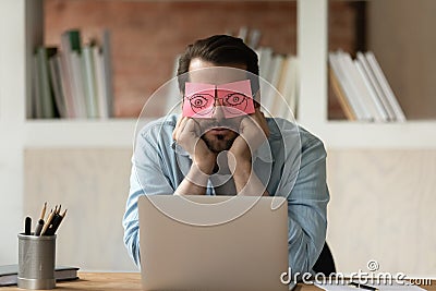 Unmotivated tired male employee sleep in office Stock Photo