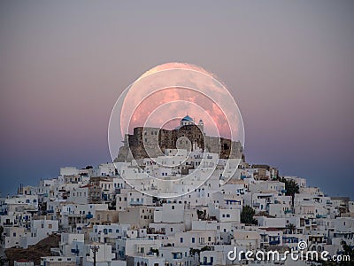 An unnatural big moon over the castle of Astypalaia Stock Photo