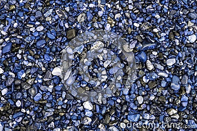 Unnatural world. Blue beach pebbles. Stones and gravel used as d Stock Photo
