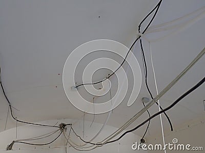 Unorganised wires on a building site Stock Photo