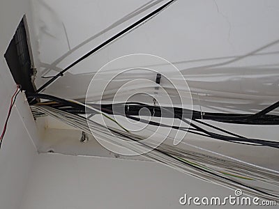 Unorganised wires on a building site Stock Photo