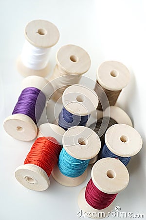 Unorganized colorful spools thread Stock Photo