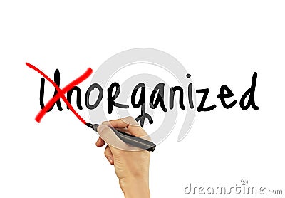 Unorganized - male hand writing text on white background Stock Photo