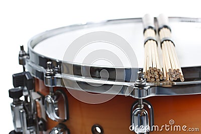 Unplugged drumsticks resting on a snare drum Stock Photo