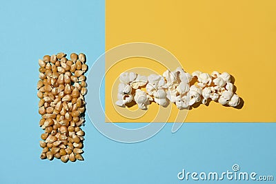 Unpopped corn and popcorn Stock Photo