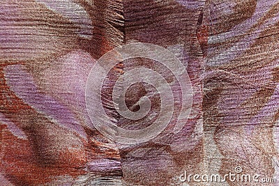 Unraveling edge of brown and mauve chiffon fabric Stock Photo