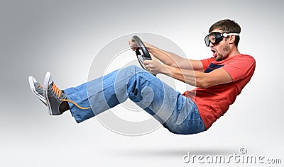 Unreal bearded funny man car driver in goggles Stock Photo