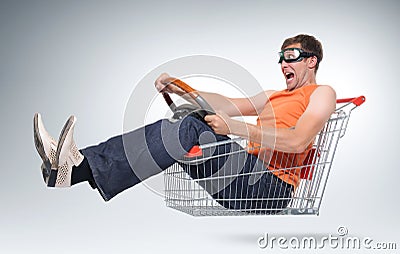 Unreal crazy driver in a shopping-cart with wheel Stock Photo