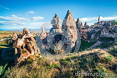 Unreal world of Cappadocia. Deep blue sky over Uchisar Castle. Bright morning scene of famous Uchisar village, district of Stock Photo