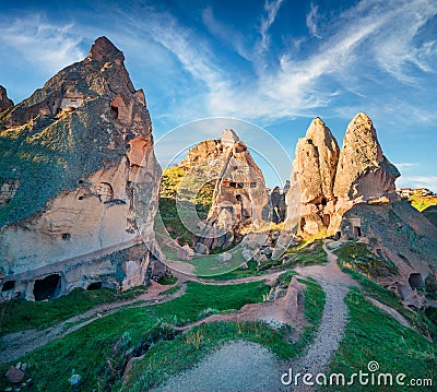 Unreal world of Cappadocia. Deep blue sky in the Uchisar Castle neighborhood. Colorful morning scene of Uchisar village, district Stock Photo