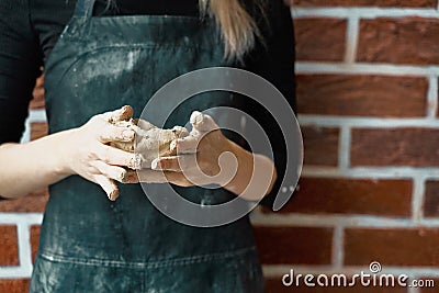 Unrecognisable woman making ceramic bowl in hand. Creative hobby concept. Earn extra money, side hustle, turning hobbies into cash Stock Photo