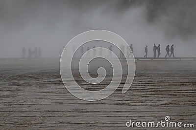 Unrecognised people walking around Grand Prismatic Spring Stock Photo