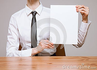 Unrecognizable businesswoman holding an empty leaf of paper Stock Photo