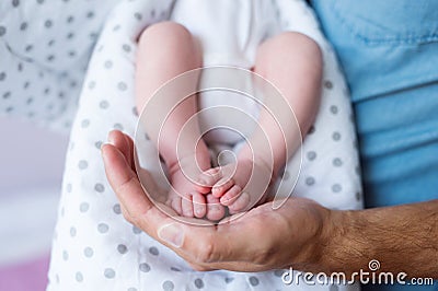 Unrecognizable father with newborn baby son, legs and hand Stock Photo