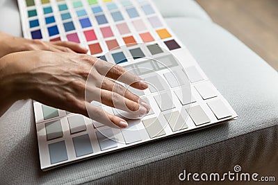 Female hands on paint swatches palette close up Stock Photo
