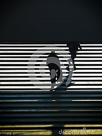 Unrecognizable lonely person silhouette walking upstairs Editorial Stock Photo