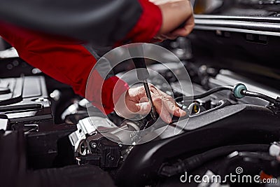 Crop technician fixing car engine Stock Photo