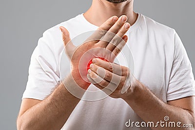 Unrecognizable man scratching itch on his hand Stock Photo