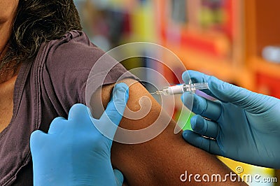 Unrecognizable woman getting vaccinated Stock Photo