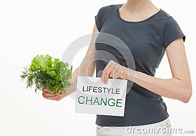 Unrecognizable young woman holding fresh greens Stock Photo