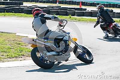 Unrecognized athlete riding a sports motorbike on a motocross racing Editorial Stock Photo