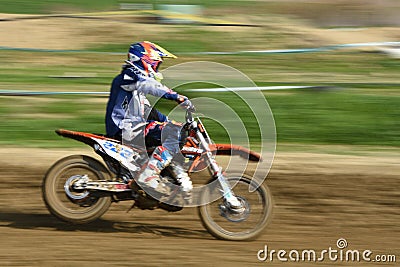 Unrecognized athlete riding a sports motorbike on a motocross racing Editorial Stock Photo