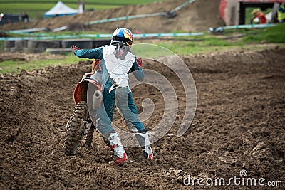 Unrecognized athlete riding a sports motorbike on a motocross racing Editorial Stock Photo