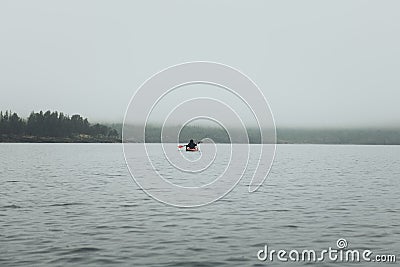 Unrecognized man in kayak. Summer trip on Ladoga lake in Karelia. Stock Photo