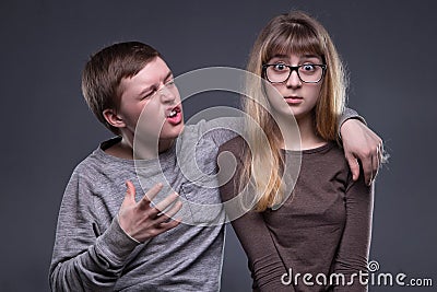 Unrequited love of teenage couple Stock Photo