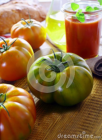 Unripe green ribbed tomato Stock Photo