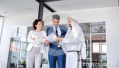 Unsatisfied business woman at meeting with Arab manager Stock Photo