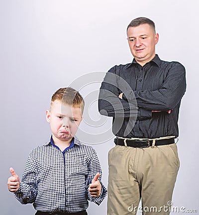 Unsatisfied with work done. childhood. trust and values. fathers day. father and son in business suit. fashion. happy Stock Photo