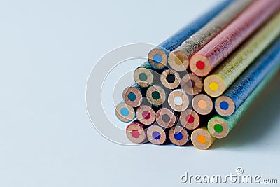 Unsharpened glitter colored pencils white background Stock Photo