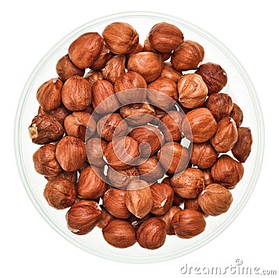 Unshelled hazel nuts in a glass bowl Stock Photo