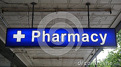 Unspecified universal Pharmacy neon sign above the entrance to a drug store Stock Photo