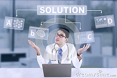 Unsure male doctor with solution Stock Photo