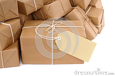 Brown paper package with blank manila label isolated on white Stock Photo