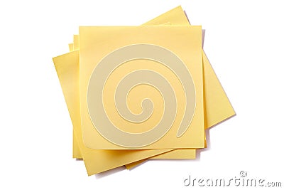 Untidy stack yellow sticky post notes isolated on white background Stock Photo