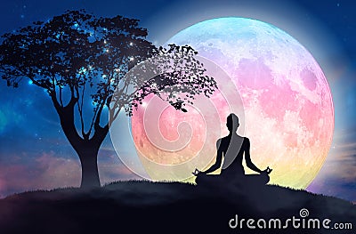 Mountain girl silhouette, meditation under stars, full pink moon Stock Photo