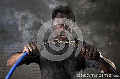 Untrained man joining cable suffering electrical accident with dirty burnt face shock expression Stock Photo
