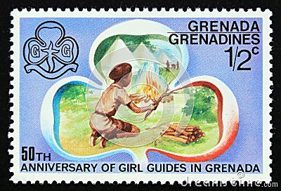 Unused post stamp Grenada Grenadines 1976, Making a camp fire Editorial Stock Photo