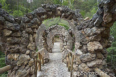 The unusual bridge of Antoni Gaudi in the gardens of Artigas Editorial Stock Photo