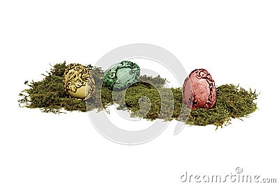 Unusual colourful vintage Easter eggs lying on moss. Stock Photo