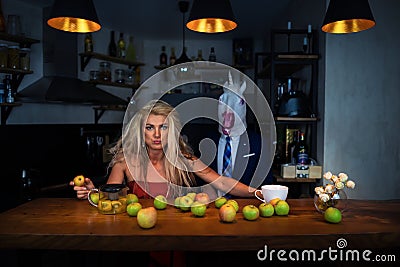 Unusual couple at bar counter in stylish kitchen Stock Photo